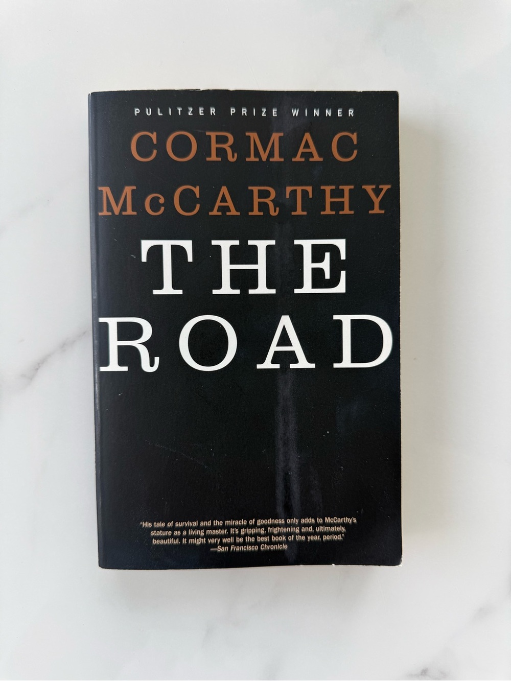 The Road by Cormac McCarthy paperback book